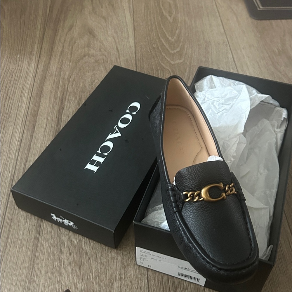 Coach Black Leather Loafers with Gold Chain Accent